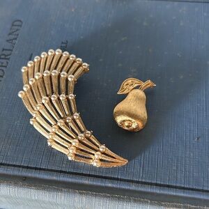 Two Vintage Goldtone Trifari Brooches